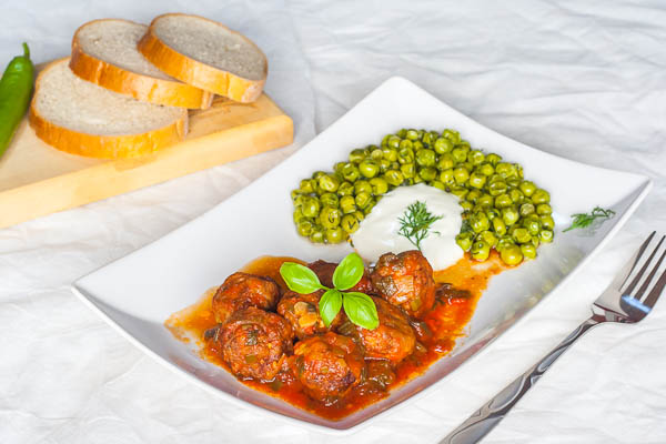meatballs in tomato sauce with sauteed peas