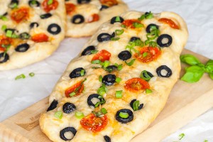 Focaccia bread with olives, cheese and cherry tomatoes