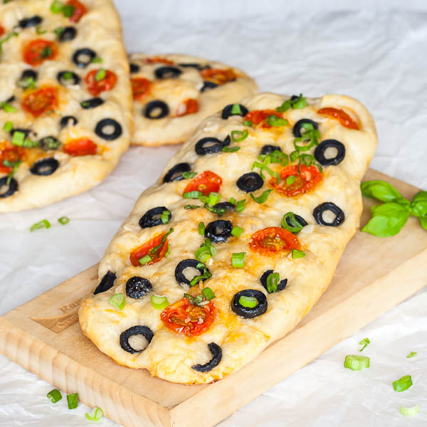Focaccia bread with olives, cheese and cherry tomatoes