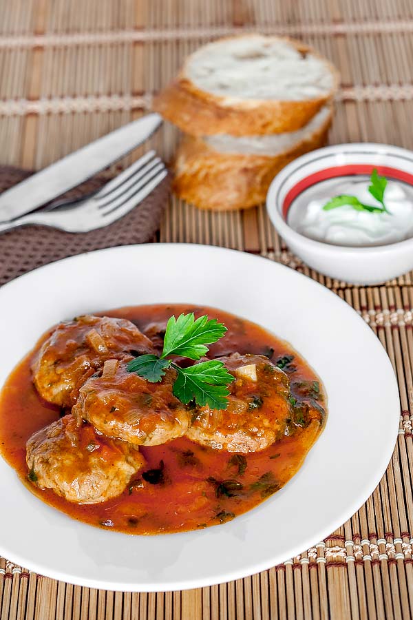 Simple and delicious meatballs with marinara sauce, fresh parsley and sour cream